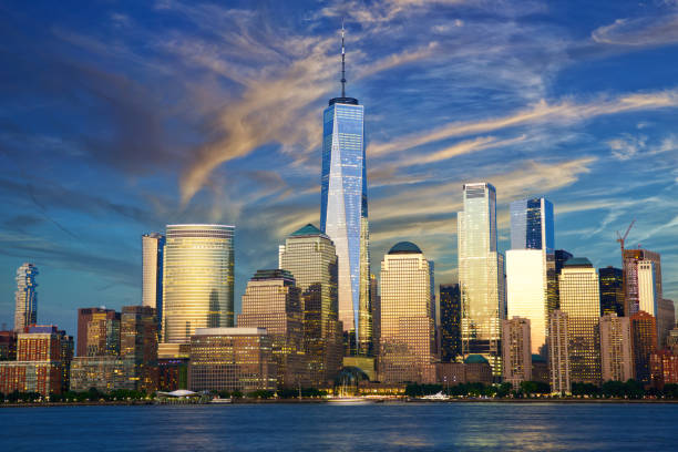 New York City financial district over Hudson River at dusk